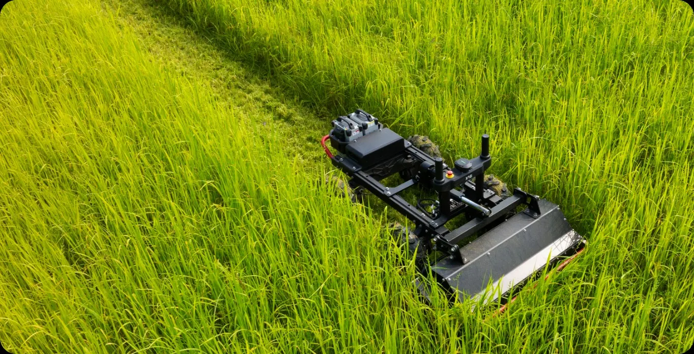 XAG RM80 on a cut path through tall grass