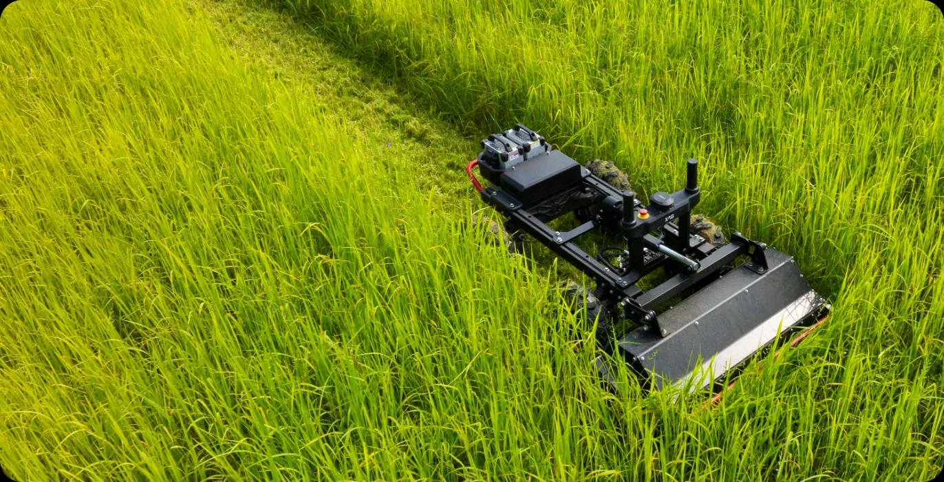 XAG RM80 unmanned mower cutting vegetation